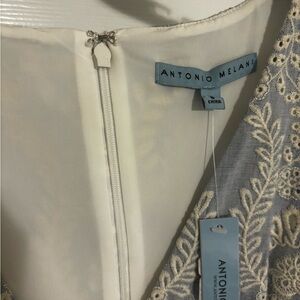 Antonio Melani blue eyelet dress. Size 8. NWT. Zipper closure and belt tie.